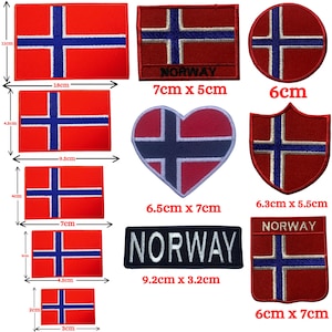 May include: A set of ten iron-on patches featuring the Norwegian flag in various shapes and sizes. The patches are red, white, and blue with the text "NORWAY" on some of the patches. The patches range in size from 3 cm to 9.5 cm.