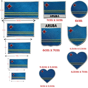 May include: A collection of Aruba flag patches in various shapes and sizes. The patches feature a blue background with a red star and two yellow stripes. Sizes range from 3 inches to 7 inches in length.