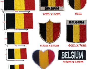 May include: A collection of embroidered patches featuring the Belgian flag in various shapes and sizes, including rectangles, shields, a circle, and a heart. Several patches include the text BELGIUM, with dimensions ranging from 3cm to 18cm.