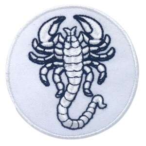May include: White embroidered patch featuring a black scorpion design. The scorpion is facing right with its tail curled upwards.