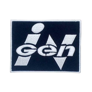 May include: A white embroidered patch with the word "igen" in a stylised font on a dark blue background.