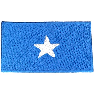 May include: A blue fabric patch with a white five-pointed star in the center.