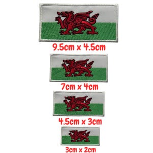 May include: Embroidered patches of the Welsh flag, showing a red dragon on a white and green background. The rectangular patches are available in four sizes: 3cm x 2cm, 4.5cm x 3cm, 7cm x 4cm, and 9.5cm x 4.5cm.
