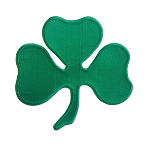 May include: A green shamrock patch with a three-leaf clover design.