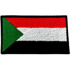May include: An embroidered patch featuring the flag of Sudan. The flag is green, red, white, and black. The green triangle is on the hoist side of the flag.