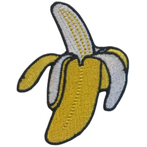 May include: A yellow embroidered banana with a white peel and black outline.