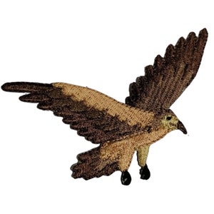 May include: A brown and tan embroidered iron-on patch of a hawk in flight.