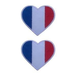 May include: Two heart-shaped patches with the French flag design. Each patch features a blue stripe on the left, a white stripe in the middle, and a red stripe on the right. The patches have a white border.