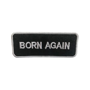 May include: Black and white embroidered patch with the text "BORN AGAIN" in white lettering.