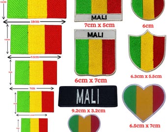 May include: A collection of embroidered patches featuring the green, yellow, and red vertical tricolor flag of Mali in various shapes and sizes, including rectangles, circles, shields, and hearts, with some patches displaying the text MALI.