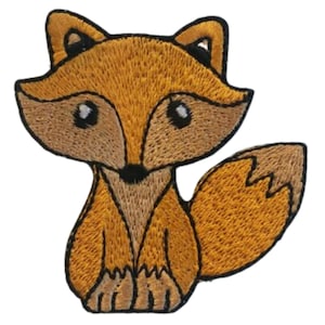 May include: Embroidered patch featuring a cartoon fox with orange and brown fur, black eyes, and a black nose. The fox is sitting upright with its tail curled. The patch has a black border and is likely for clothing or accessories.