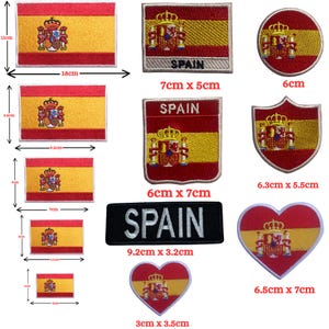 May include: A selection of embroidered patches displaying the Spanish flag and coat of arms. The patches come in various shapes and sizes, including rectangular, circular, and heart-shaped. The largest patch is 18 cm x 11 cm, and the smallest is 3 cm x 2 cm. Some patches have the word "SPAIN" embroidered on them.