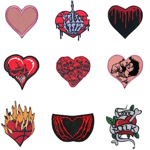 May include: Nine embroidered iron-on patches in the shape of hearts. The patches feature various designs including skulls, flames, skeletons, and a couple kissing.