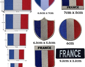 May include: A collection of embroidered patches featuring the French flag in various shapes and sizes, including rectangles, a heart, a shield, and a circle. Some patches include the text FRANCE. Dimensions range from 2cm by 3cm to 11cm by 18cm.