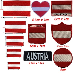 May include: A set of ten iron-on patches featuring the Austrian flag in various shapes and sizes. The patches include a rectangle, a heart, a shield, a circle, and a rectangular patch with the word "AUSTRIA" printed on it. The patches are all red, white, and red, with the white stripe in the middle.