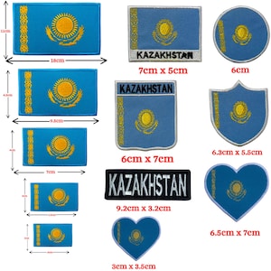 May include: A selection of embroidered Kazakhstan flag patches in various shapes. The patches feature the blue flag with a gold sun and eagle emblem. Sizes vary, with the largest patch measuring 18cm x 11cm.