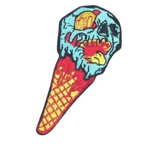 May include: A blue and red ice cream cone with a skull face melting out of the top. The cone is yellow and has a waffle pattern.