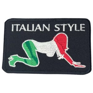 May include: A black embroidered patch with the text "ITALIAN STYLE" in white. The patch features a stylised image of a woman in the colours of the Italian flag.