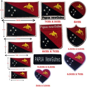May include: A collection of embroidered patches featuring the Papua New Guinea flag design in various shapes and sizes, including rectangles, circles, shields, and hearts, with visible measurements ranging from 3 cm to 18 cm in width.