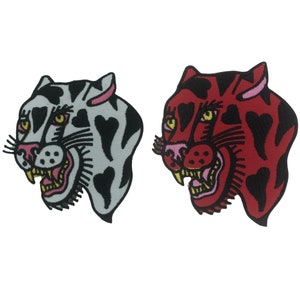 May include: Two embroidered iron-on patches of a snarling tiger head with black hearts on a white and red background.
