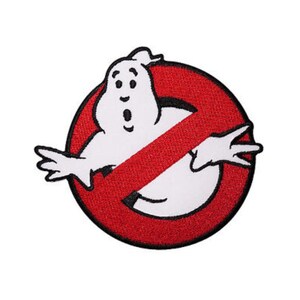 May include: A red circle with a diagonal red line through it. Inside the circle is a white cartoon ghost with a surprised expression. The text "No Ghost" is written in black letters below the ghost.