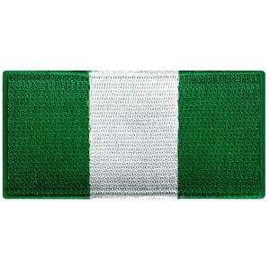 May include: A green, white, and green fabric patch with the colors arranged vertically. The patch is made of a woven material and has a slightly textured surface.
