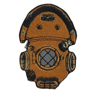 May include: Embroidered patch depicting a vintage diving helmet. The patch is predominantly orange with black and grey details, including the faceplate and air supply. This patch is likely for a jacket or bag.