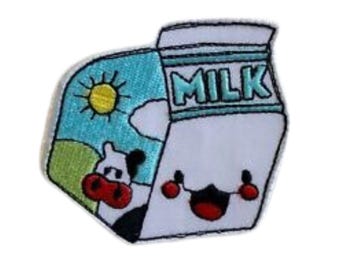 May include: An embroidered iron-on patch depicting a cartoon milk carton with a smiling face and a cow peeking out from behind it. The carton is white with blue lettering that says "MILK". The background is a blue sky with a yellow sun and green grass.