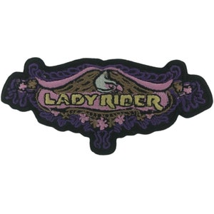 May include: Purple and pink embroidered patch with the text "LADY RIDER" in gold lettering.