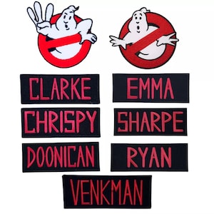 May include: Seven black and red embroidered patches with the names "Clarke", "Chrispy", "Doonician", "Venkman", "Emma", "Sharpe", and "Ryan" in red lettering. The patches are surrounded by two images of the Ghostbusters logo with a ghost.