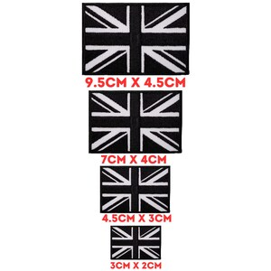 May include: Four black and white Union Jack flag patches in different sizes. The patches are 9.5 cm x 4.5 cm, 7 cm x 4 cm, 4.5 cm x 3 cm, and 3 cm x 2 cm.