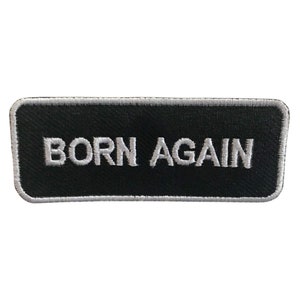 May include: Black rectangular patch with white embroidered text that reads "BORN AGAIN".