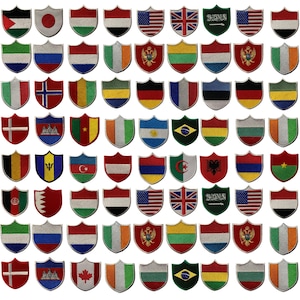 May include: A collection of 64 embroidered iron-on patches featuring various country flags in a shield shape. The flags are arranged in 8 rows of 8 patches each.