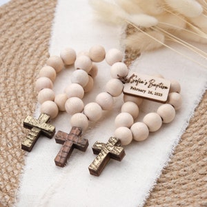 These mini wooden rosary favors are perfect for any religious occasion, such as baptism, christening, communion, or confirmation. They are handmade with love and care, using high-quality wood beads.