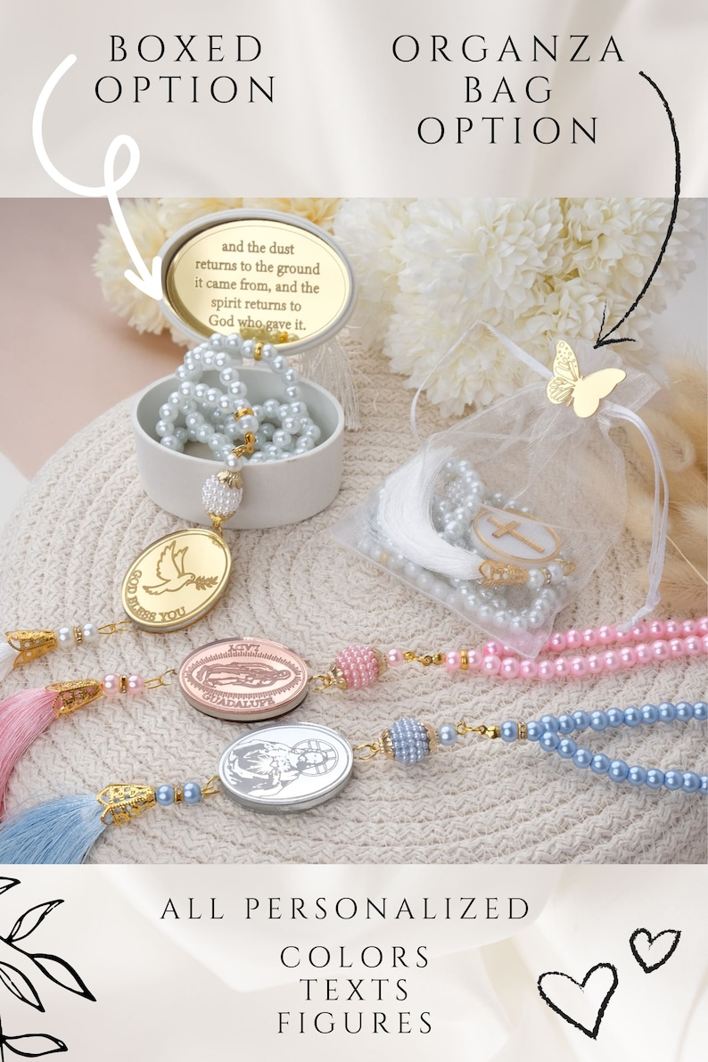 May include: A set of pearl prayer beads with a variety of charms, including a dove, a religious figure, and a butterfly. The beads are available in pink, blue, and white. The beads are packaged in a white box with a gold lid and a white organza bag with a gold butterfly charm. The text "God Bless You" is on the dove charm. The text "and the dust returns to the ground it came from, and the spirit returns to God who gave it." is on the lid of the box. The text "ALL PERSONALIZED COLORS TEXTS FIGURES" is at the bottom of the image.