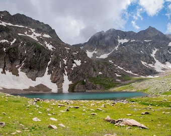 Mountain lake and rocky mountains. Crystal clear lake in the middle of the rocks. Lake, mount, peak, hill, stone, fields. Interior design