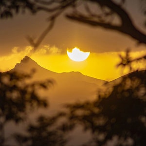 High mountains and golden sunset. The sun over the mountains. Sunrise wall art decor. Sunset digital print. Orange sky and rocky mount photo