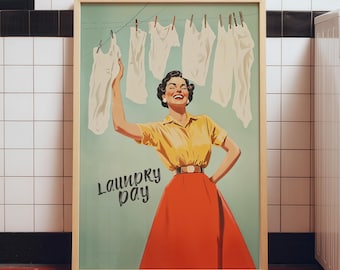 May include: A framed poster featuring a smiling person in a yellow shirt and red skirt standing before a clothesline with white garments hanging. The text Laundry Day is printed in black script on the light green background of the illustration.