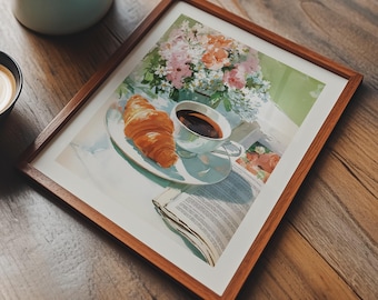 May include: A still-life image featuring a light blue teapot, a small black bowl of latte, and a framed print. The print depicts a croissant, coffee, and flowers. The scene is set on a wooden surface, evoking a cozy breakfast setting.