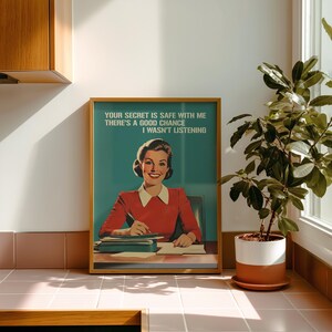 Retro 1950s style office humor wall art print of a smiling woman in a red shirt at a desk writing, with the bold teal text "YOUR SECRET IS SAFE WITH ME THERE'S A GOOD CHANCE I WASN'T LISTENING" written at the top.