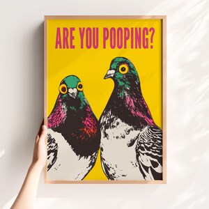 Bright pop art bright yellow poster of two pigeons staring forward,  funny toilet poster or guest bathroom art with text that reads “ARE YOU POOPING?”