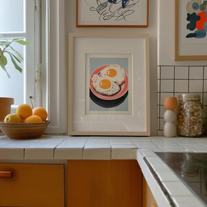 Digital illustration of two fried eggs on a red striped plate with a blue background, styled as mid mod kitchen and pop art egg decor for quirky breakfast wall art.