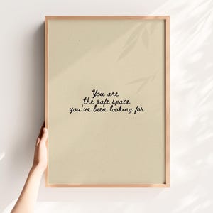 Minimalist typography on a beige background with the text: "This is a safe space, you are allowed to be yourself here."
