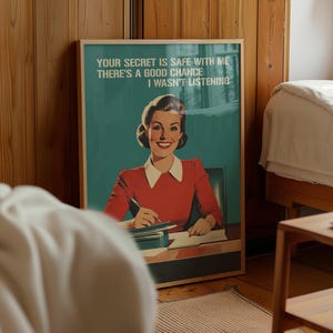 Retro 1950s style office humor wall art print of a smiling woman in a red shirt at a desk writing, with the bold teal text "YOUR SECRET IS SAFE WITH ME THERE'S A GOOD CHANCE I WASN'T LISTENING" written at the top.