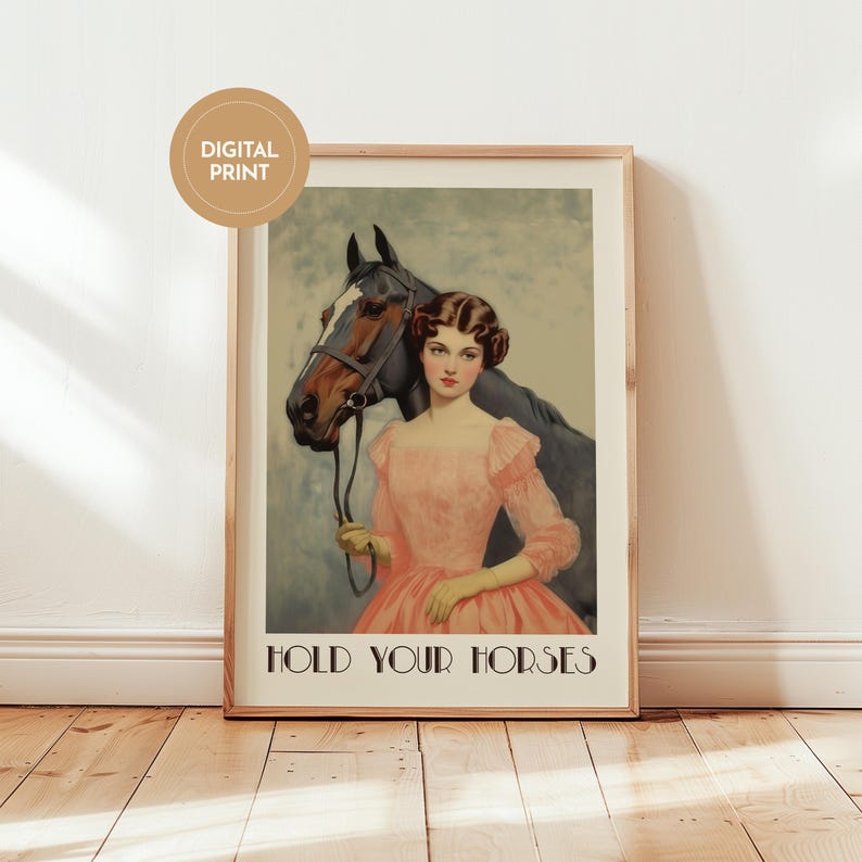 Vintage-style poster of a woman in a pink dress standing beside a horse, styled as equestrian wall art with country chic art and western decor charm, text reads “HOLD YOUR HORSES”