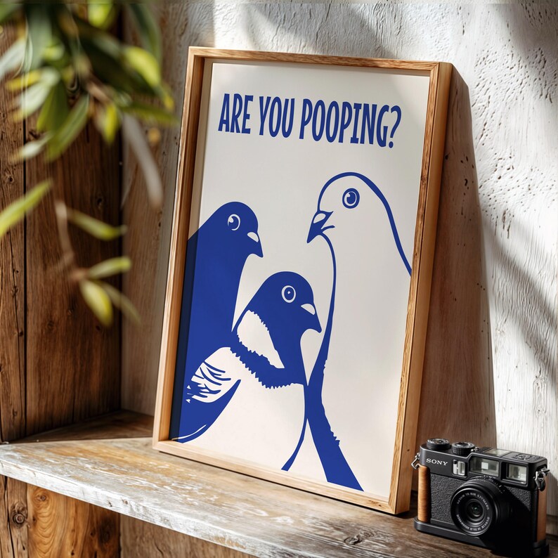 Funny pigeon bathroom art showing three cobalt-blue birds peering at the viewer beneath the text “ARE YOU POOPING?”—a playful toilet poster for a guest bathroom, powder room or quirky gallery wall.