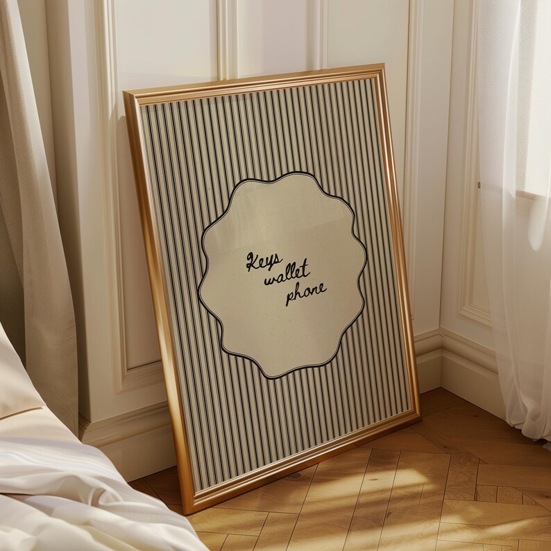 Hand drawn poster with the text "Keys wallet phone" inside a scalloped border on a neutral pinstripe background. Simple modern art used as Functional decor for Apartment decor or an Art for hall.