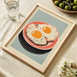 Digital illustration of two fried eggs on a red striped plate with a blue background, styled as mid mod kitchen and pop art egg decor for quirky breakfast wall art.