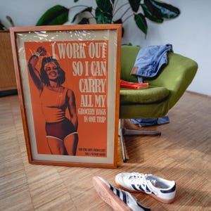 Orange retro vibe art workout poster with strong female figure and quote — motivational poster, gym wall art, home gym decor.