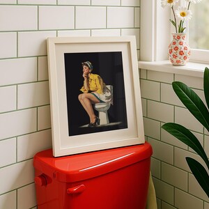 Funny retro style black and yellow toilet wall art with a retro pin-up lady sitting on a toilet, designed as funny bathroom art for restroom wall decor.